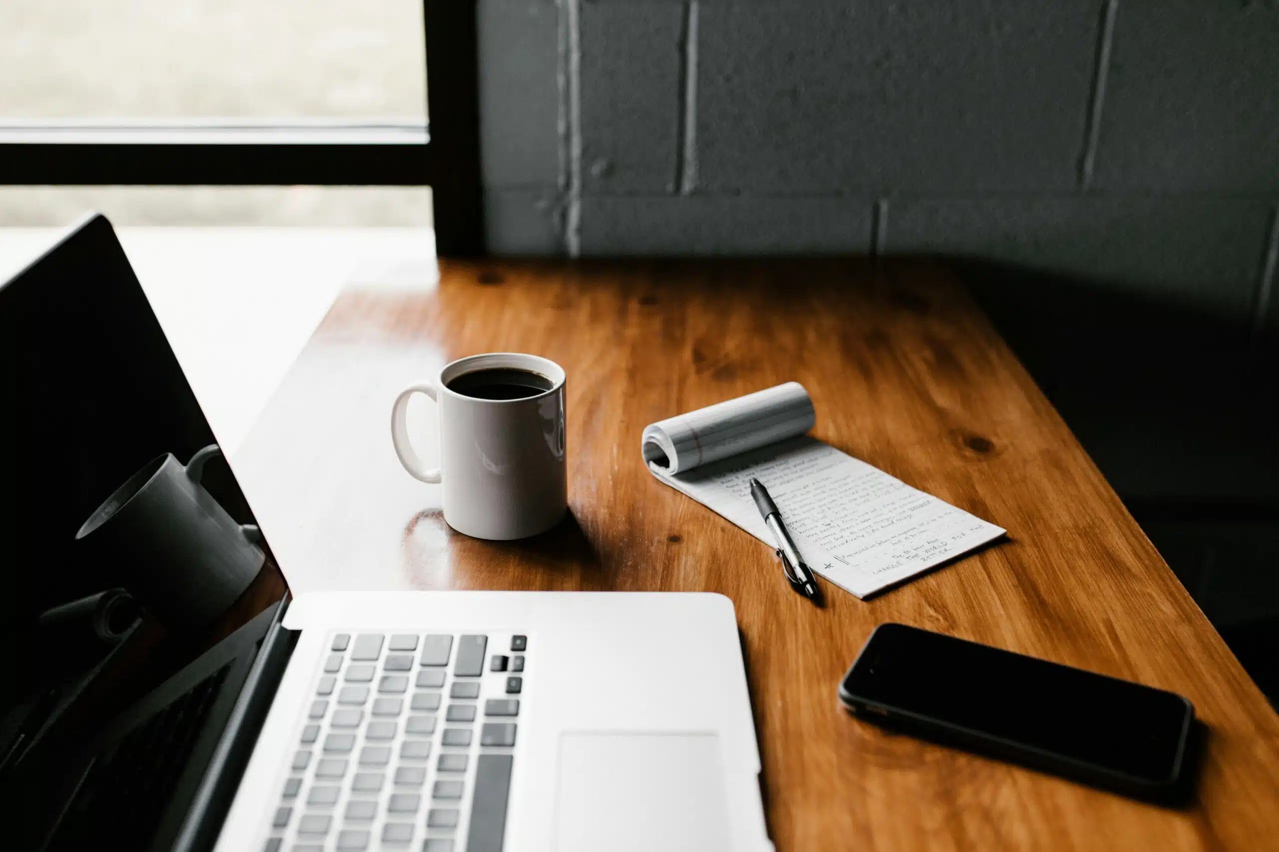 a workspace with laptop notebook 