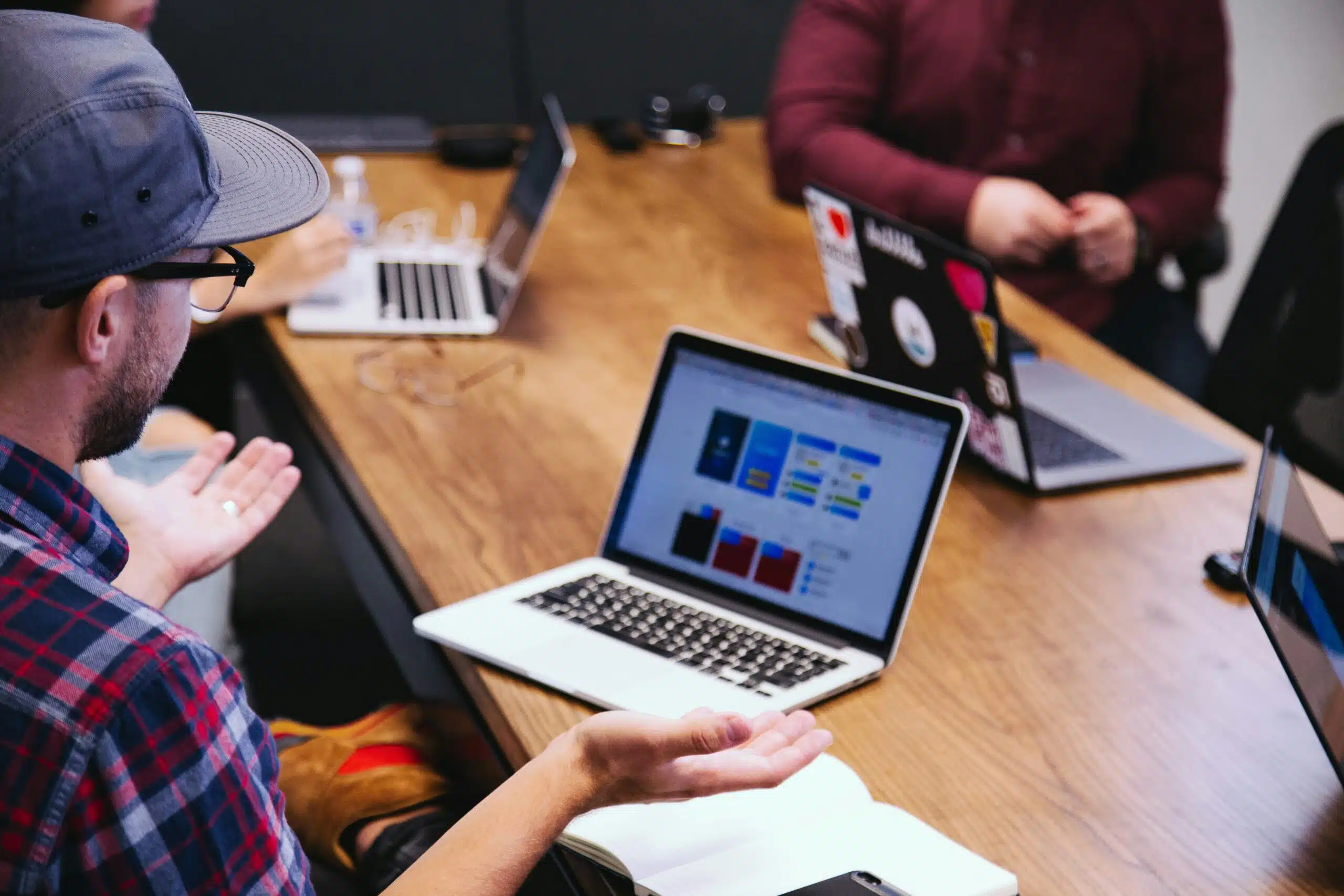 Team analyzing AI-powered sales dashboard during a strategy meeting