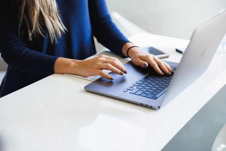 woman working on a laptop in a modern workspace