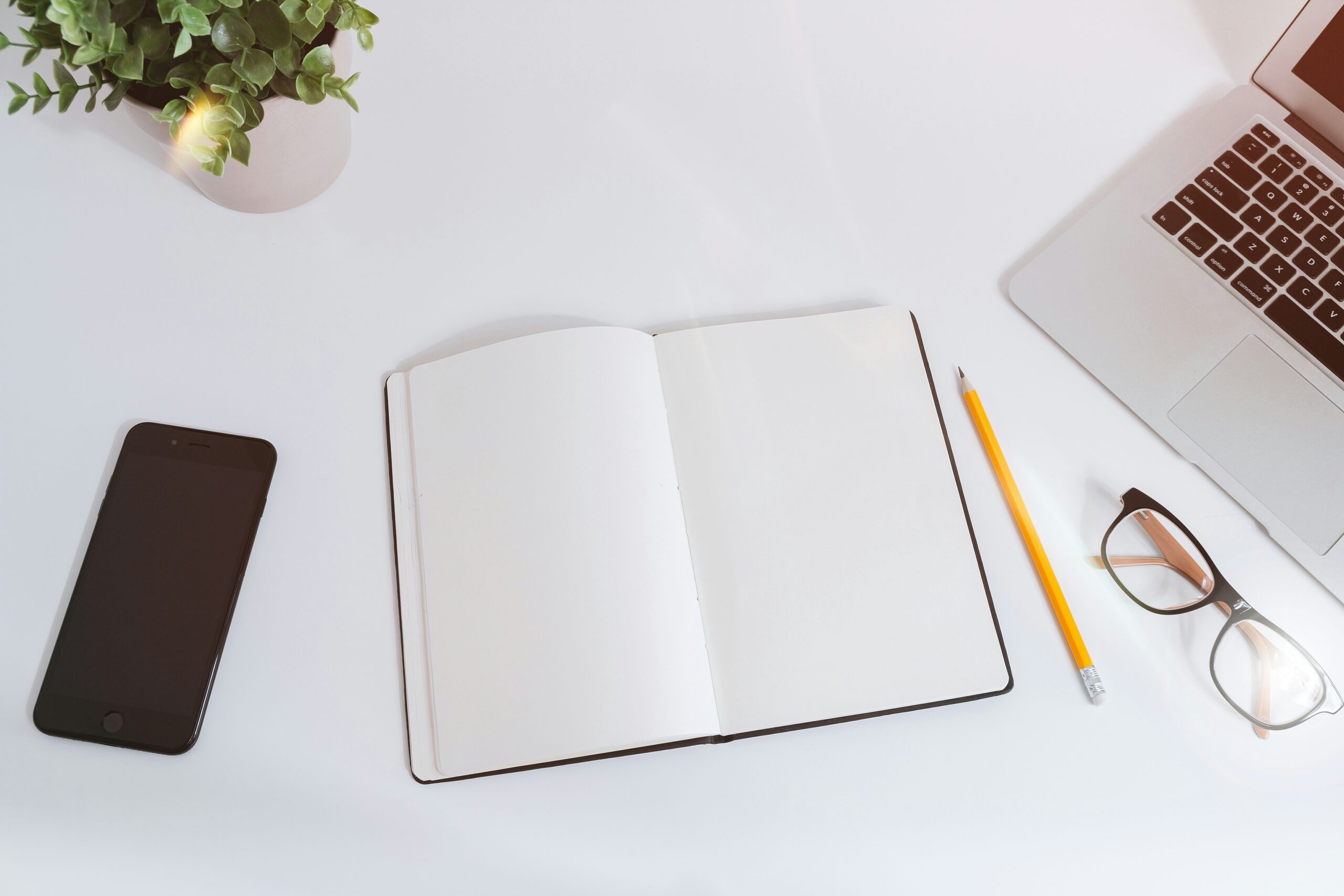 diary and laptop on a desk