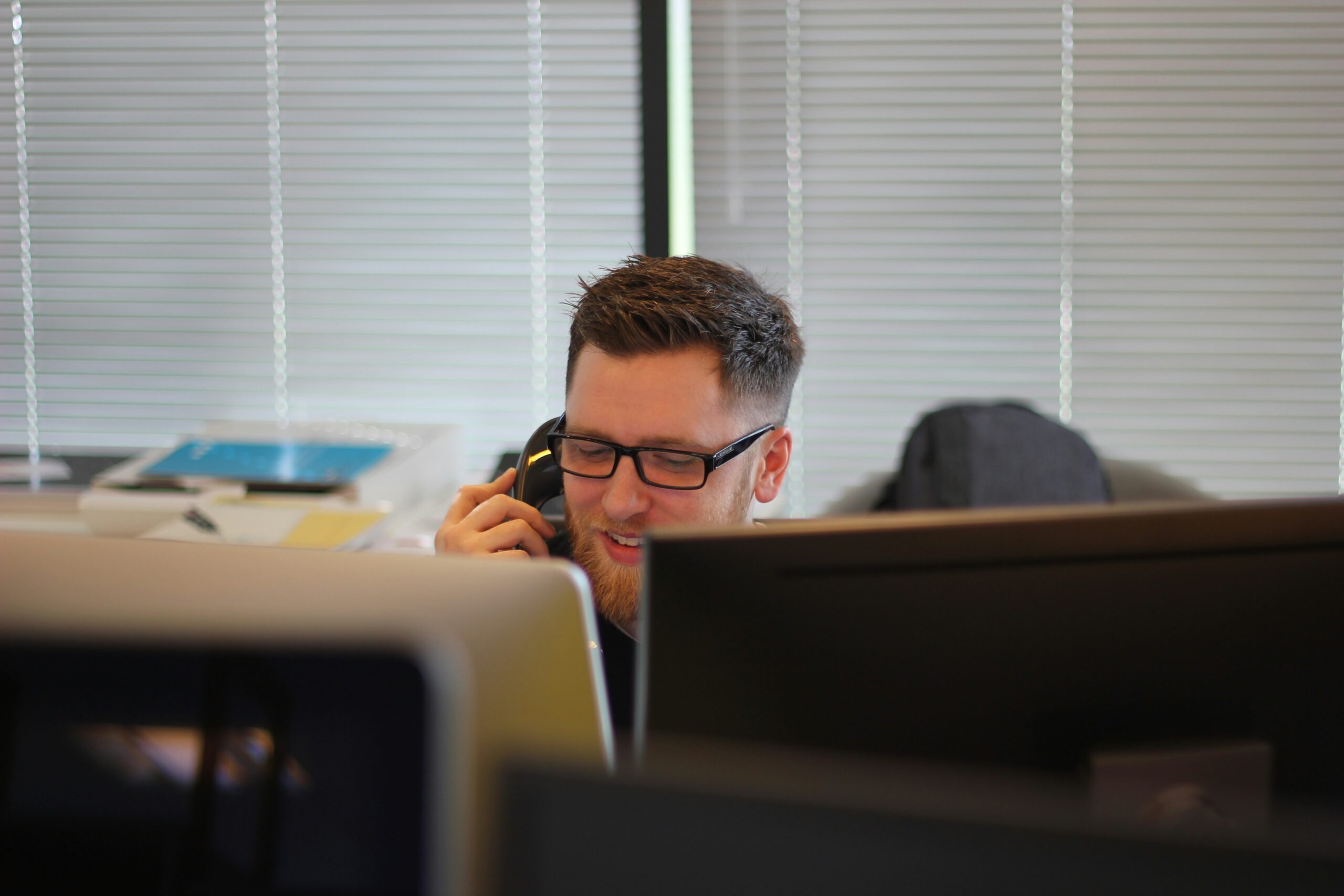  A customer support representative on a phone call in an office