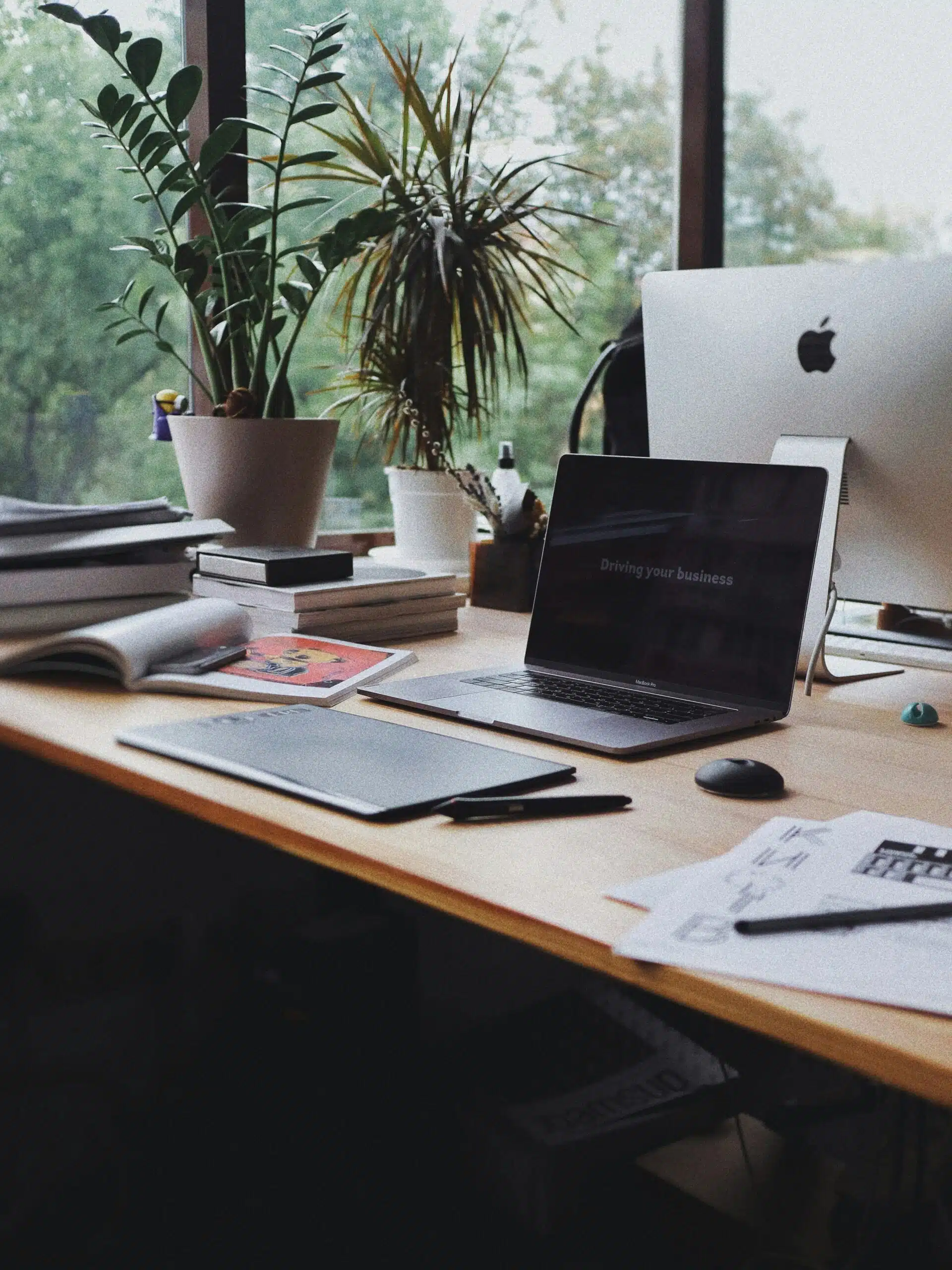 Workspace with a laptop and analytics documents