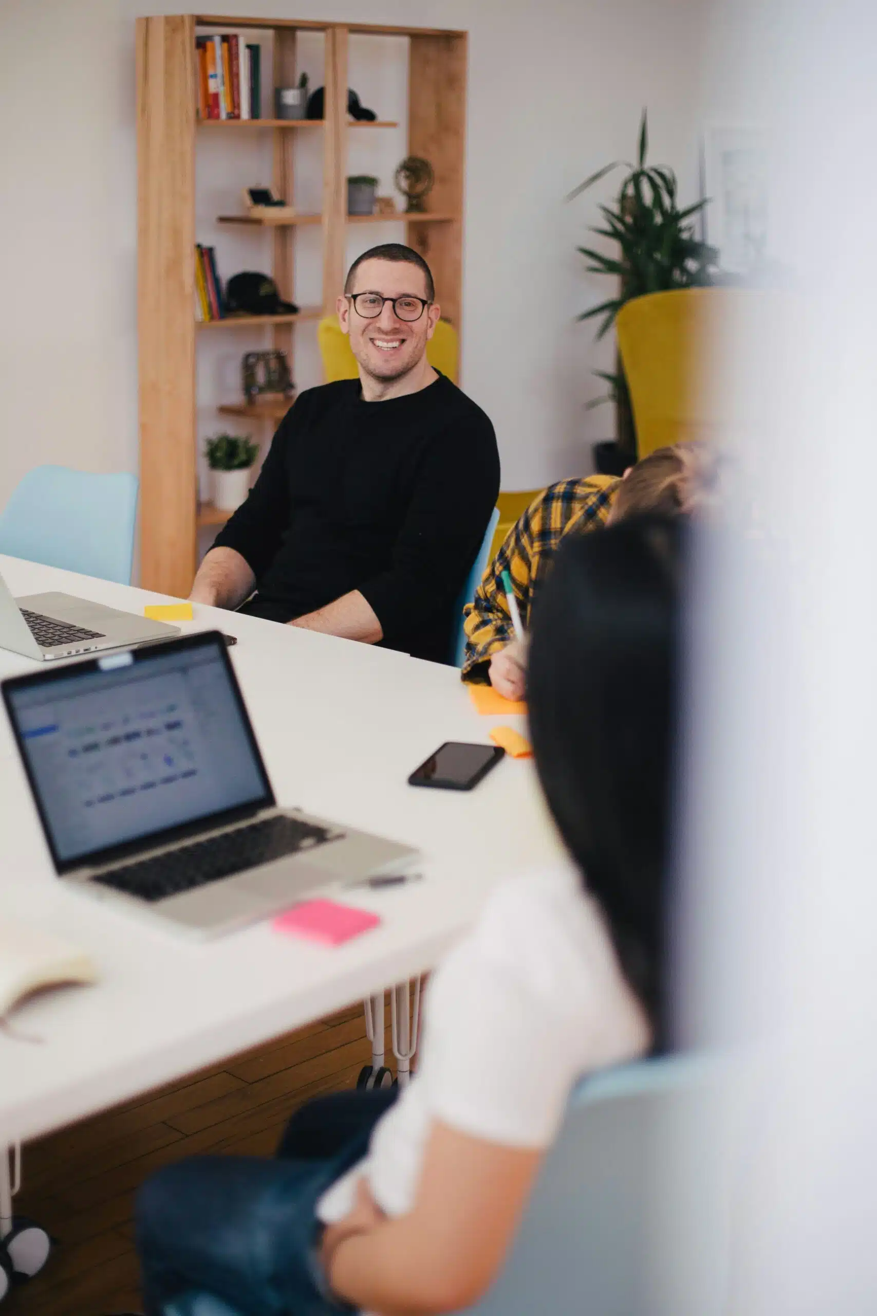 Business professionals in a meeting discussing AI-driven market research platforms.