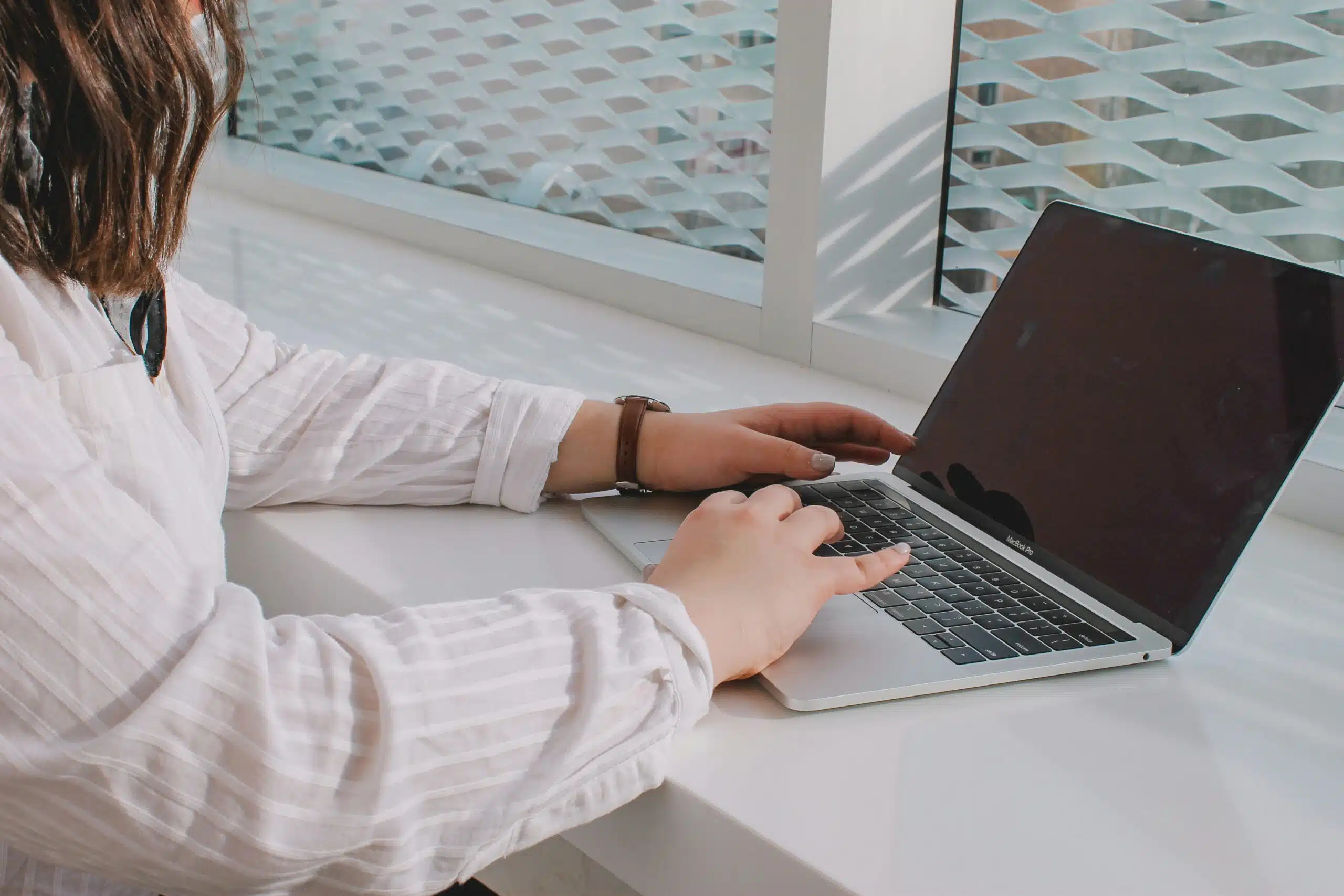 a woman using a laptop