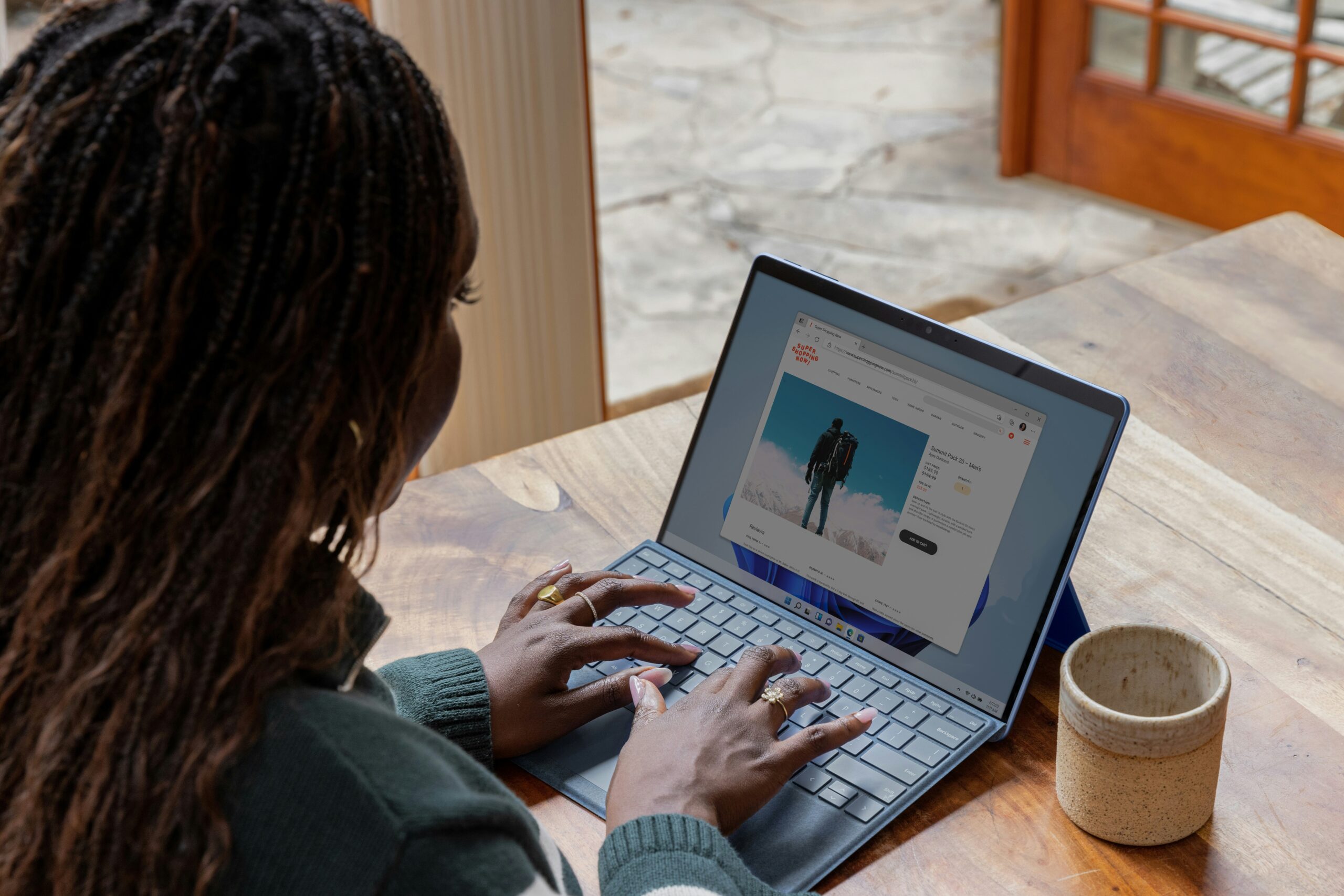 a woman working on a laptop creating content