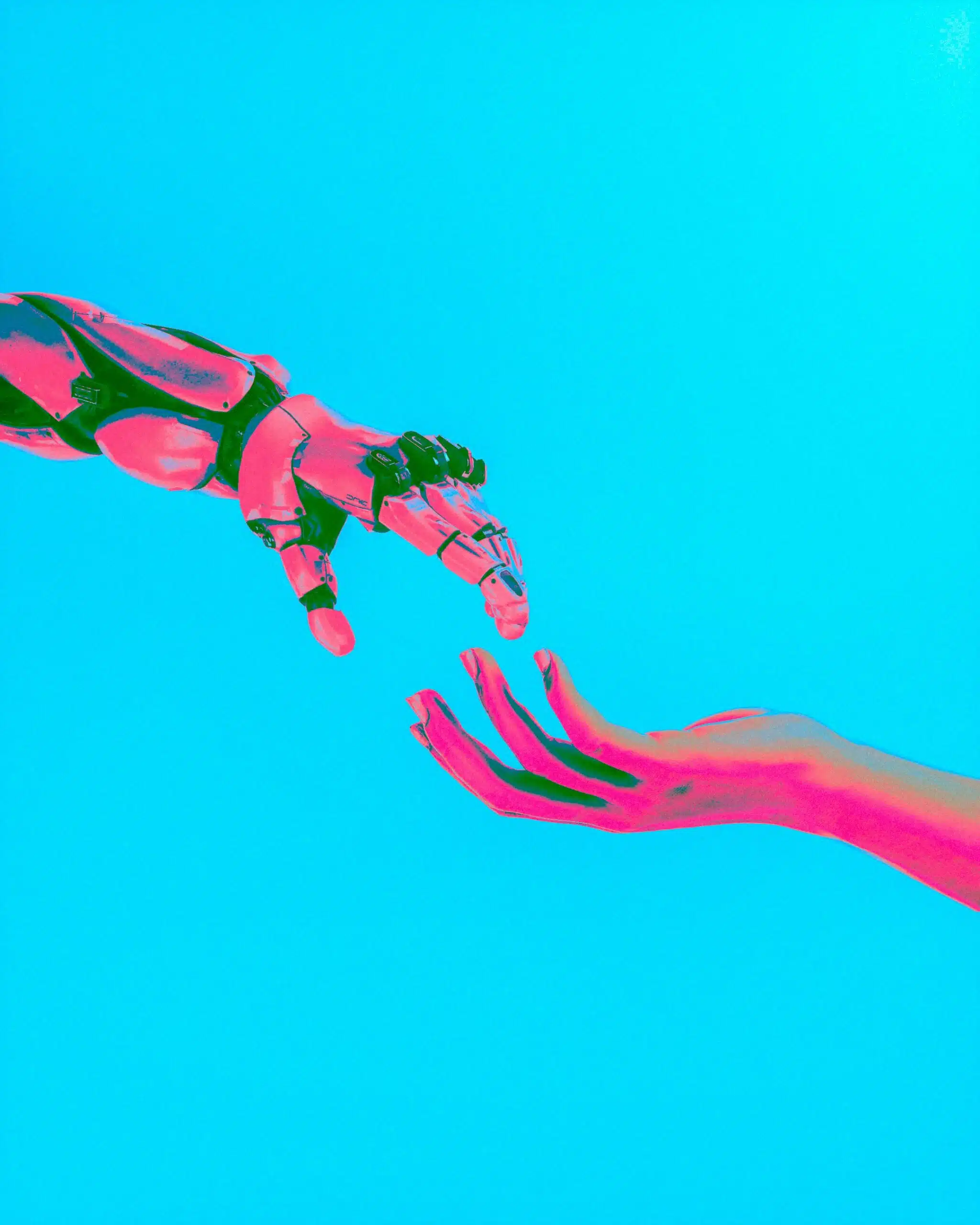a robot hand reaching out for a human hand