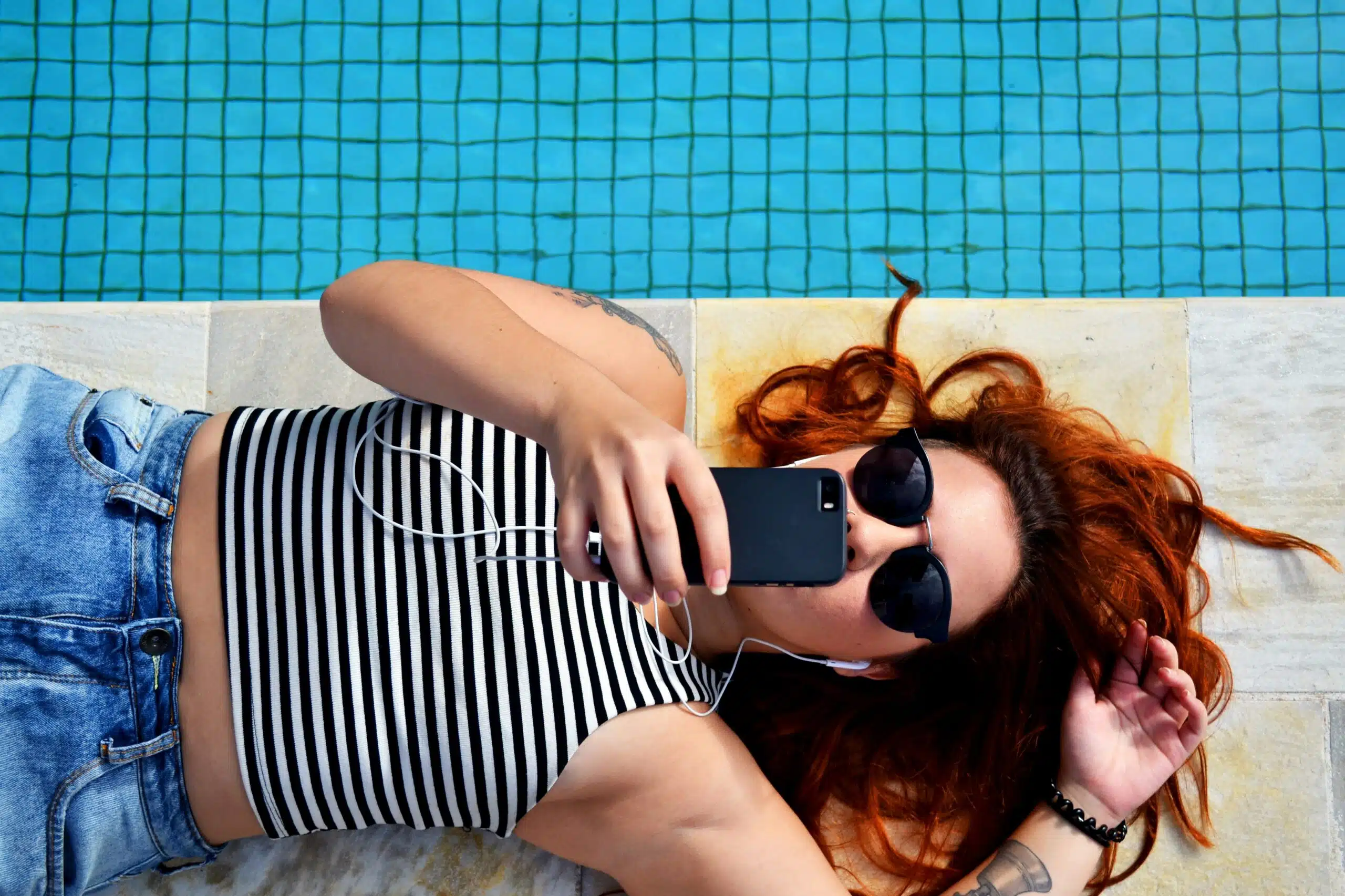 a person using phone connected with airphones