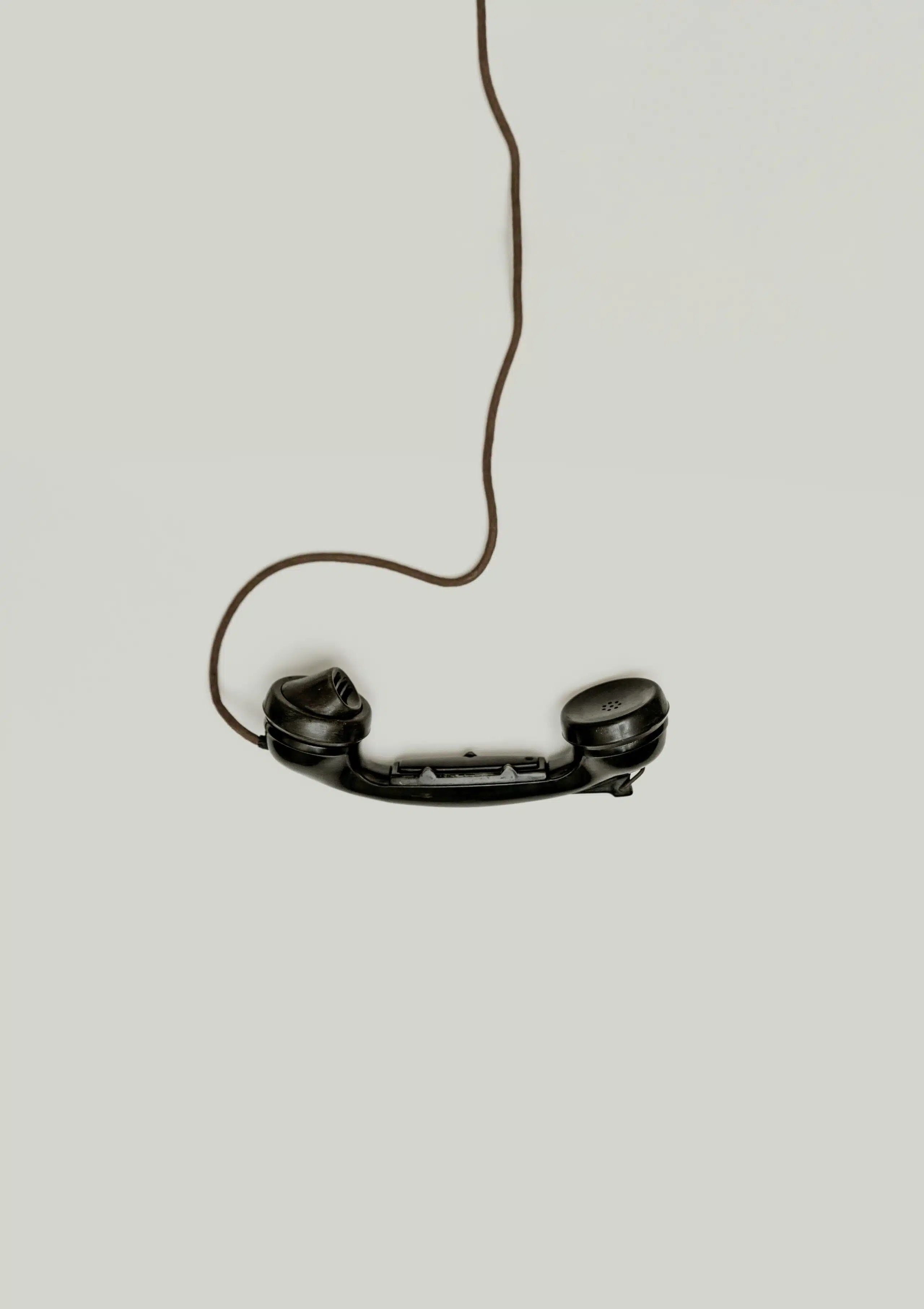 a phone danling from the cord