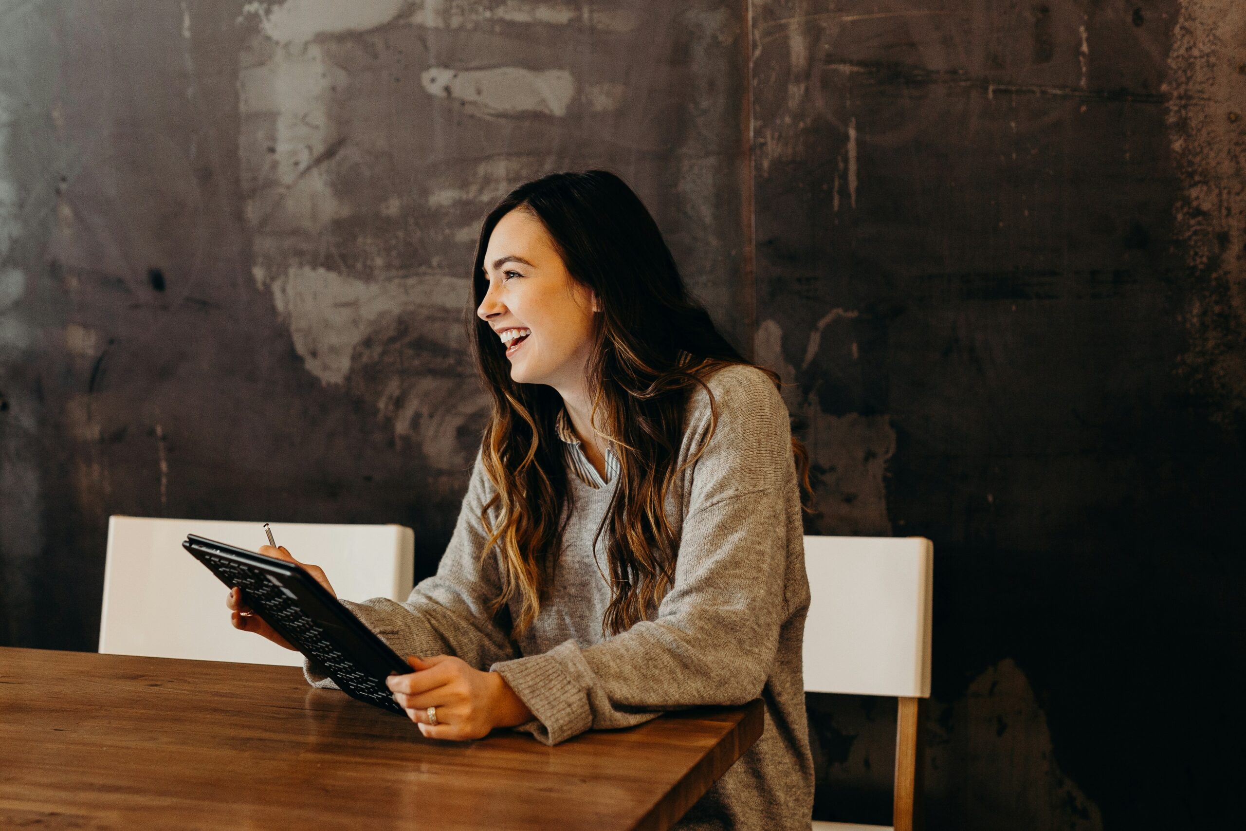 A marketing professional reviewing data insights on a tablet