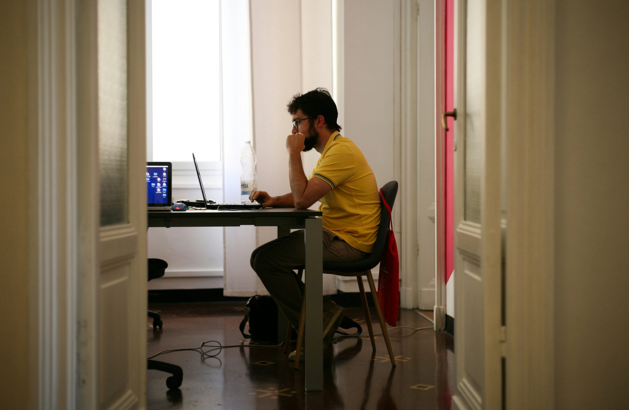 Marketing professional analyzing data on a laptop