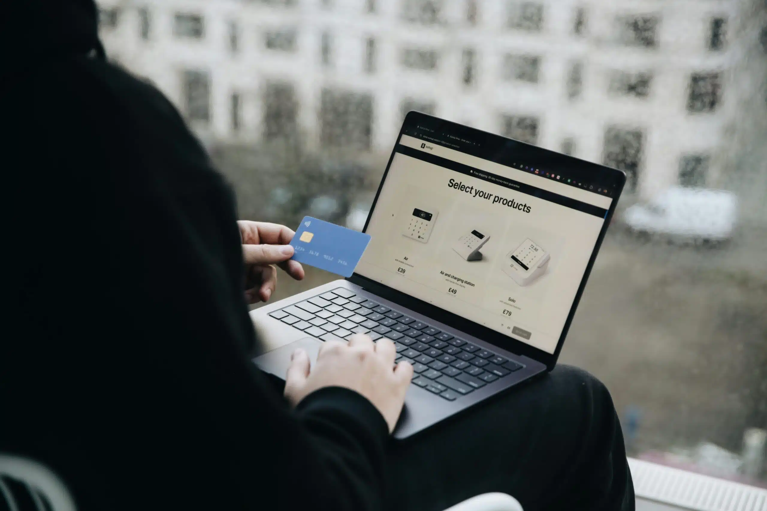 A person using a laptop for customer data analysis with AI tools.