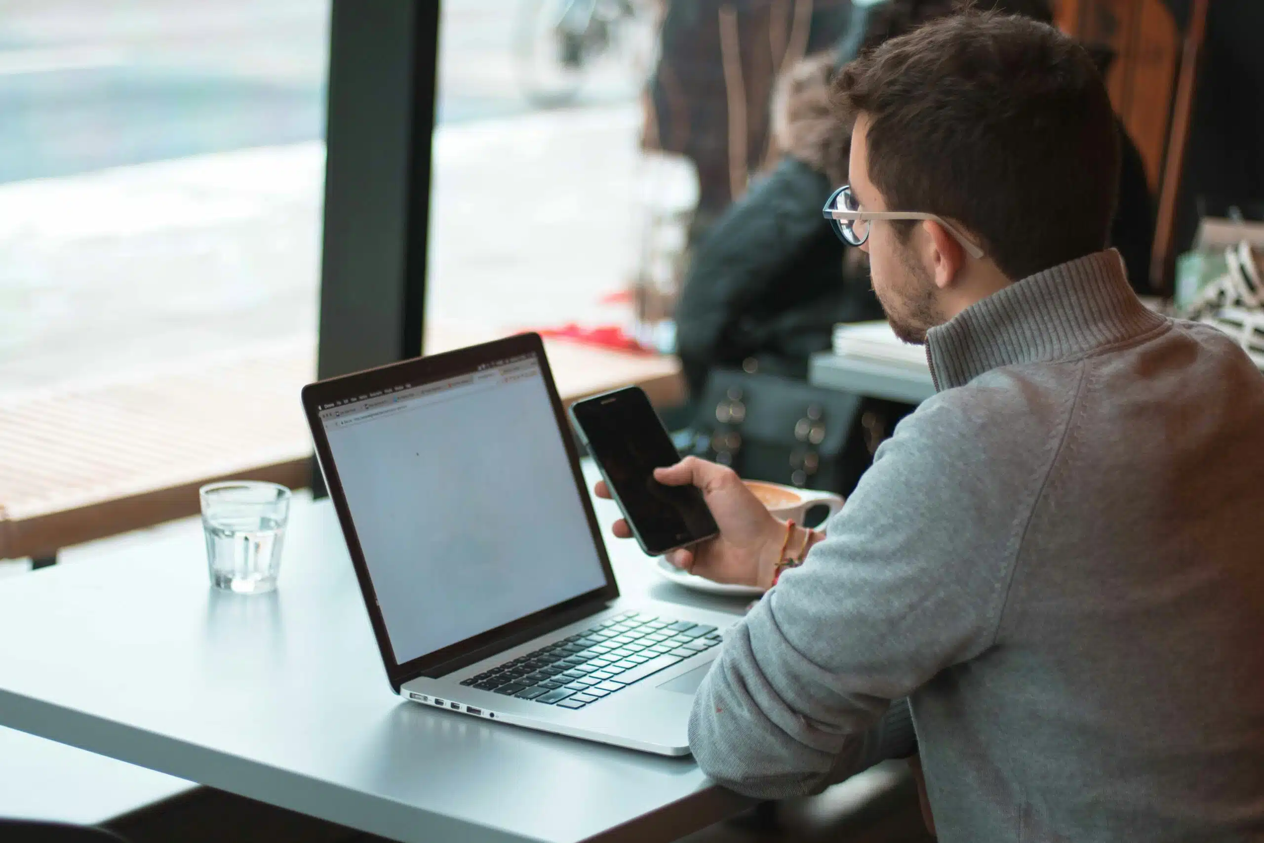 A marketer working at an indoor cafe