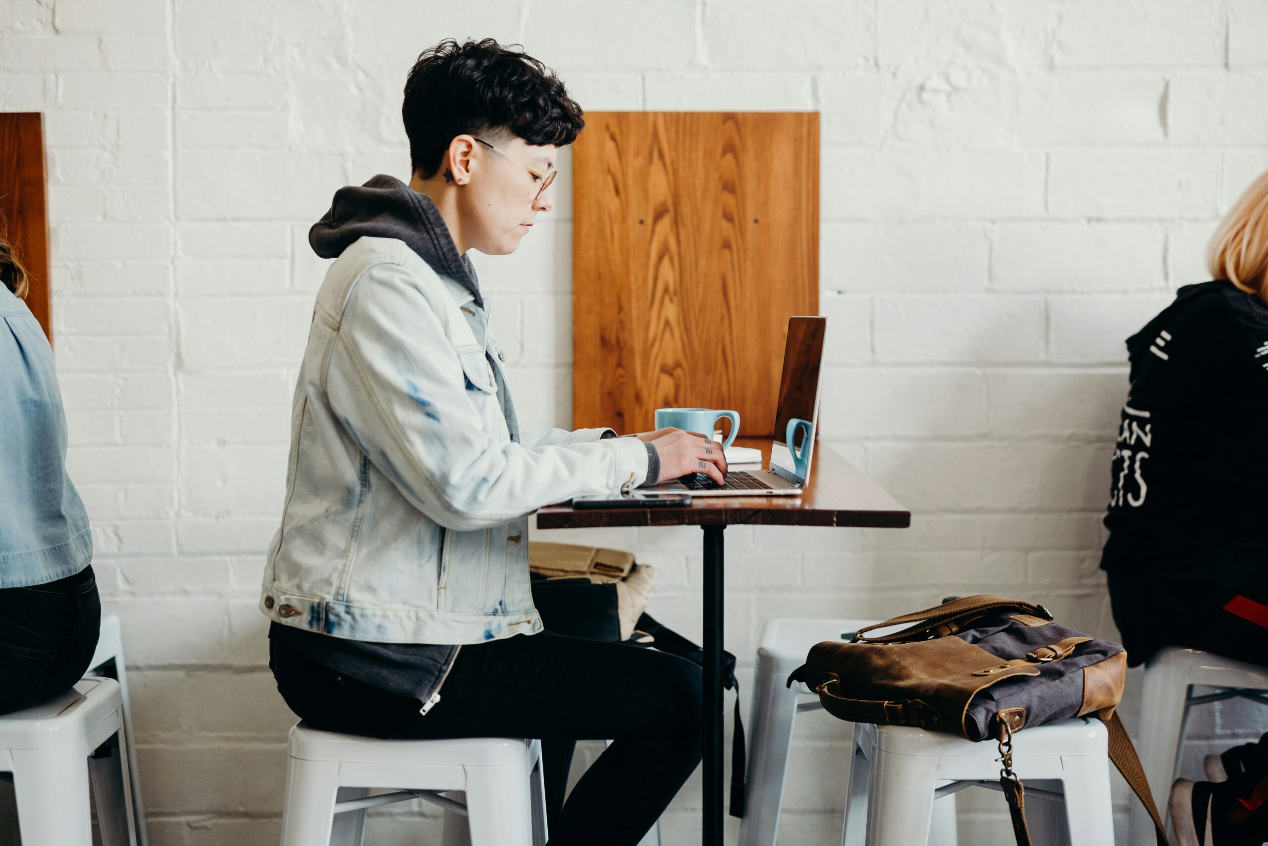 a person on their laptop - AI Marketing Tools a person on their laptop