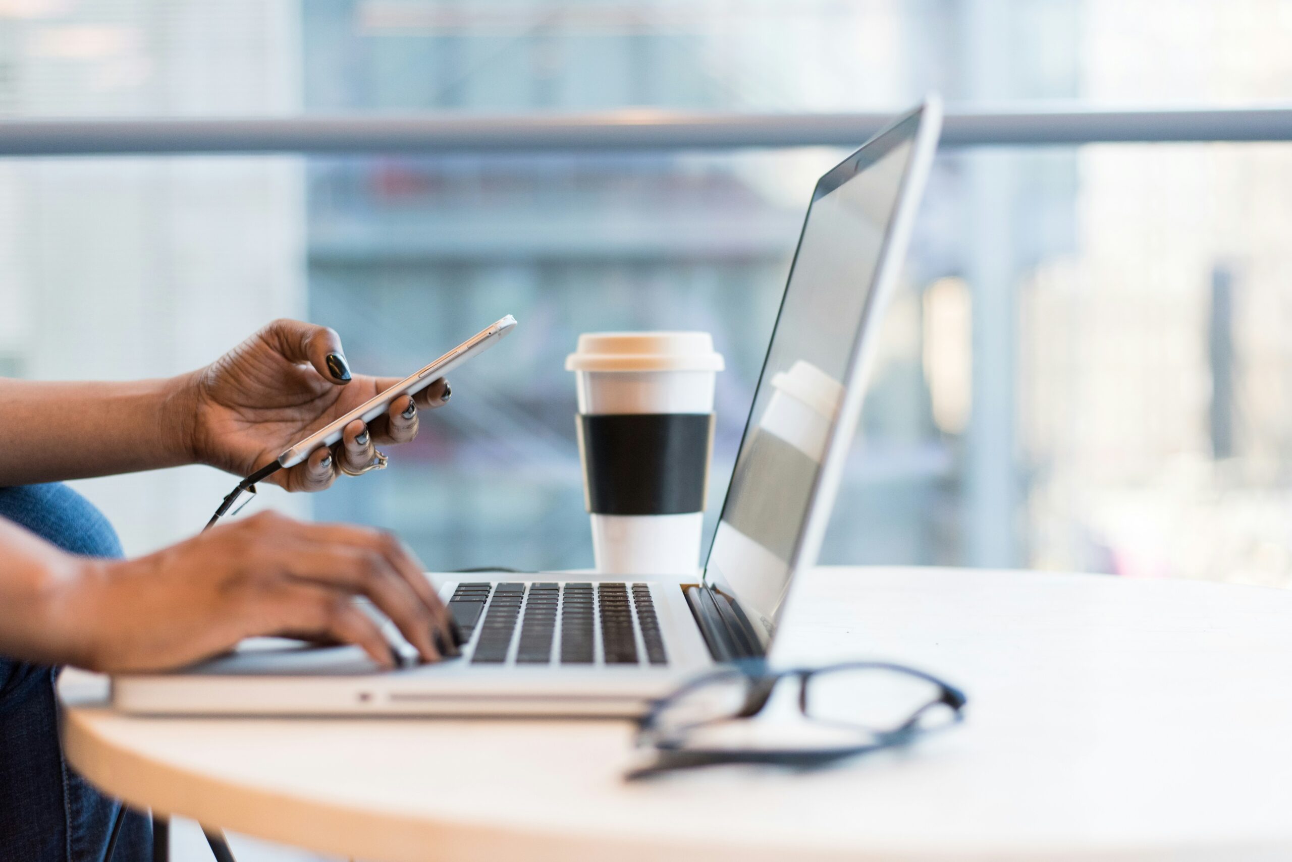 a marketer on their desk - AI Marketing Tools a marketer on their desk
