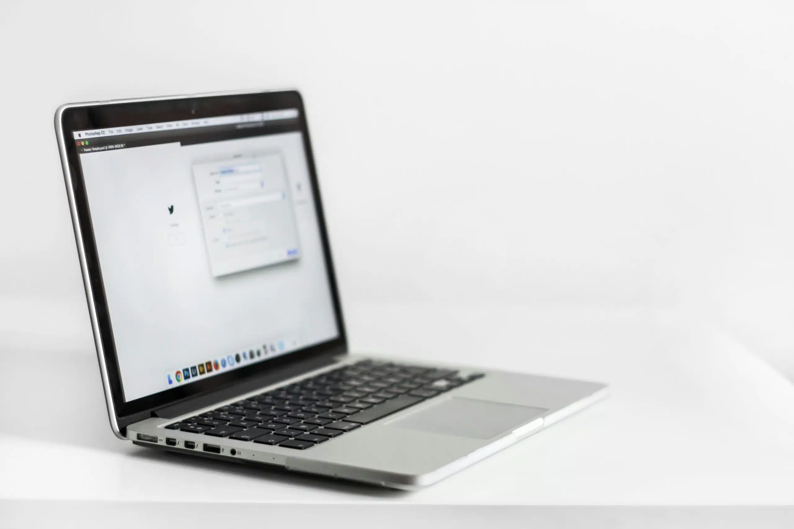 laptop placed on a white desk with ai marketing tool open