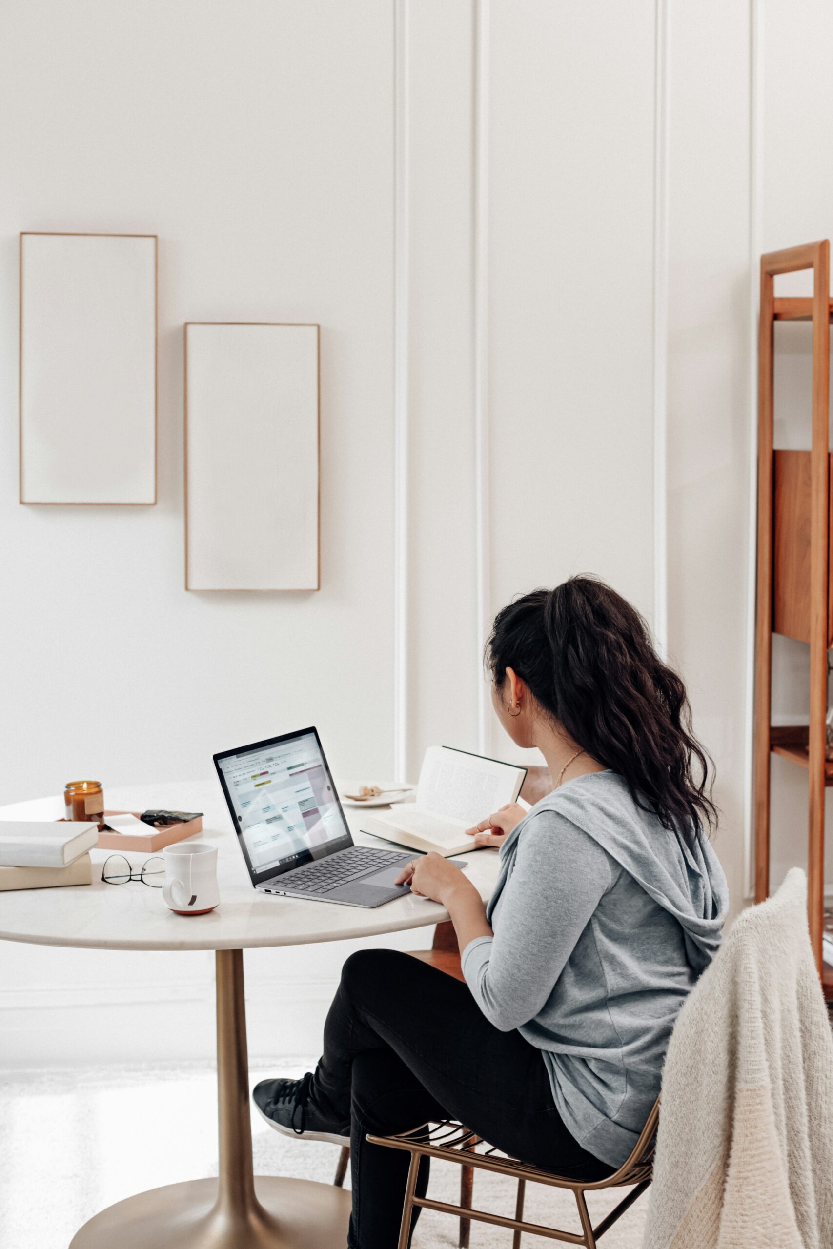 a woman in a home office space working on a laptop - AI Marketing Tools a woman in a home office space working on a laptop