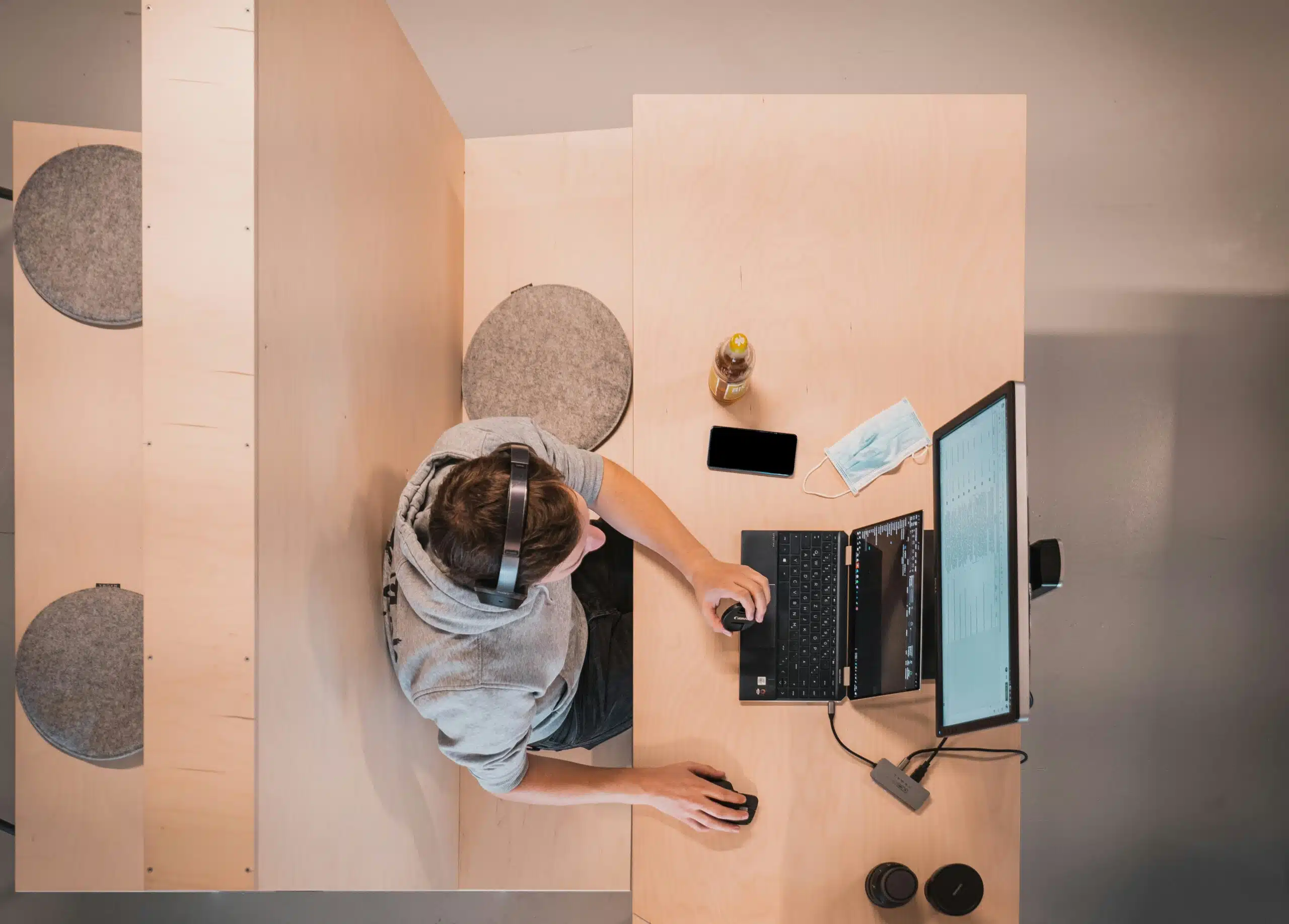 top view of a guy working on laptop in office space