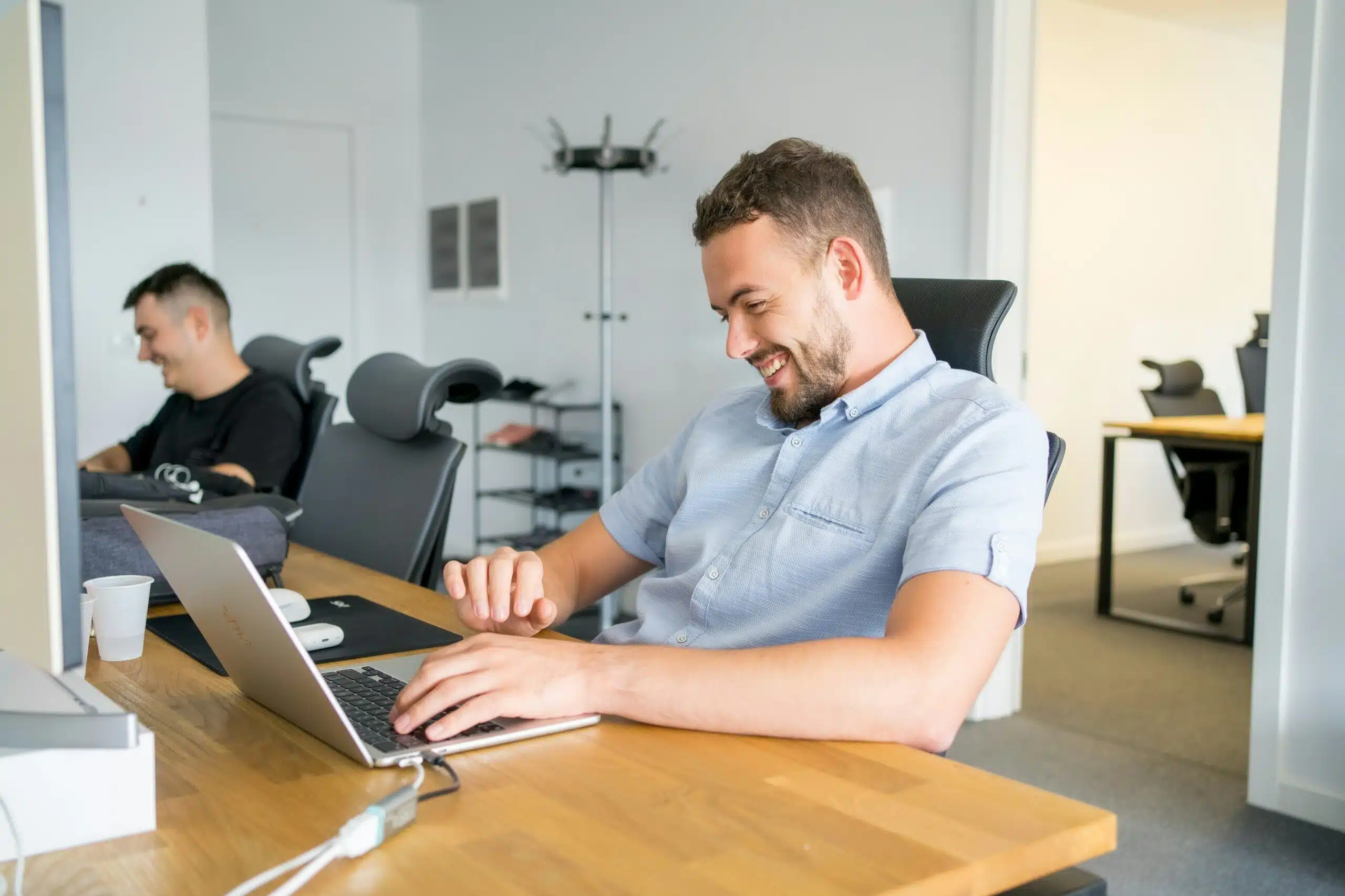 marketing professional in an office smiling and working