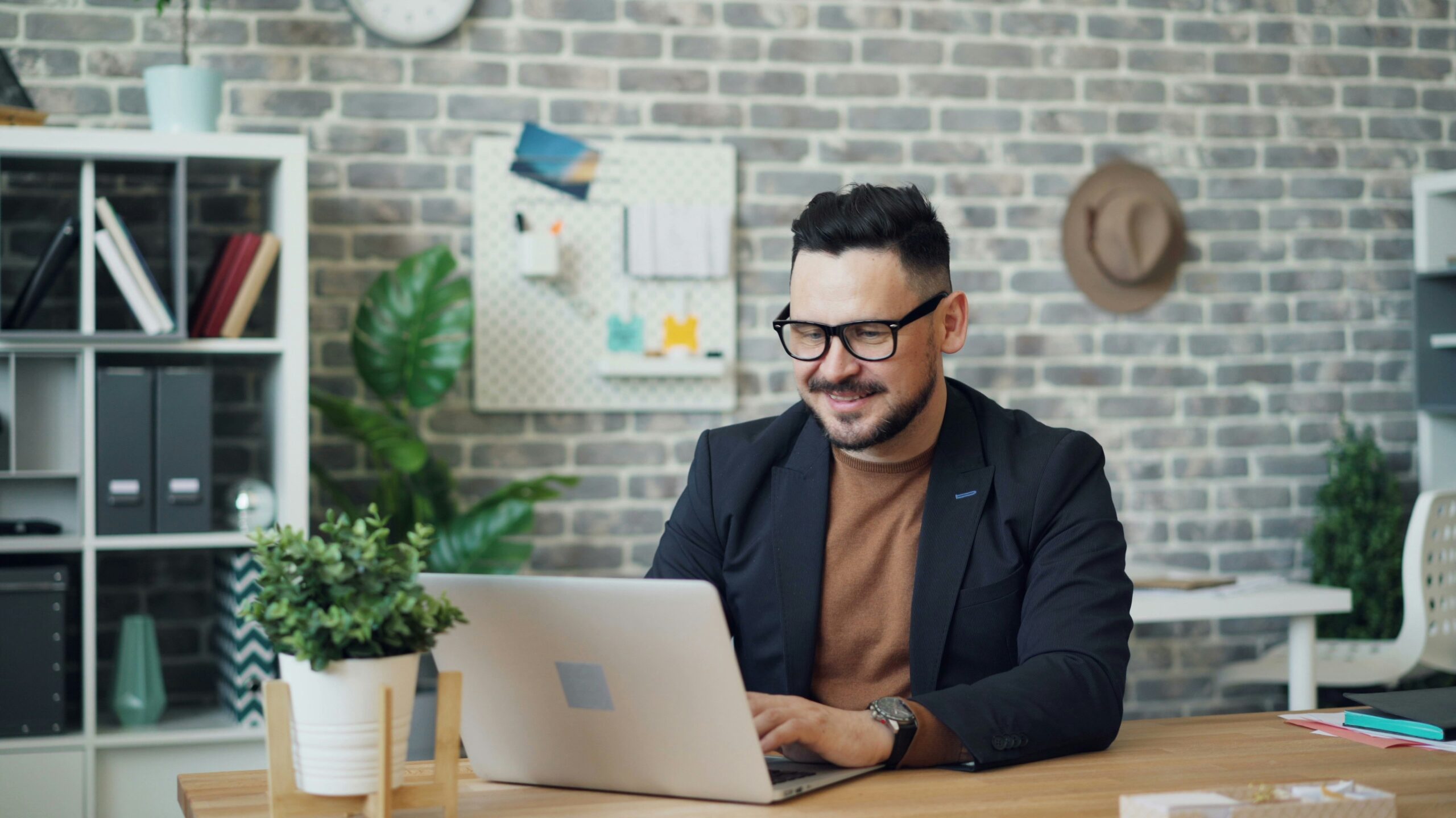 A professional working on a laptop in a modern office, reflecting a positive environment focused on continuous skill development and growth. - AI Marketing Tools A professional working on a laptop in a modern office, reflecting a positive environment focused on continuous skill development and growth.