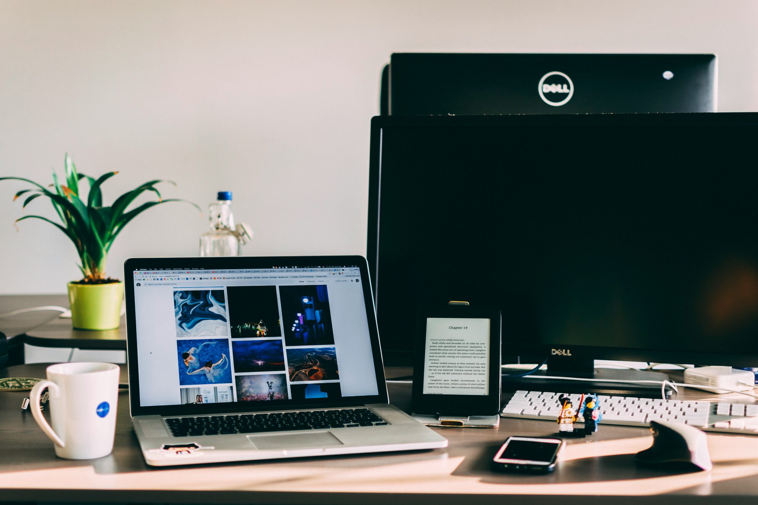 Creative workstation with a laptop displaying visual content - AI Marketing Tools Creative workstation with a laptop displaying visual content