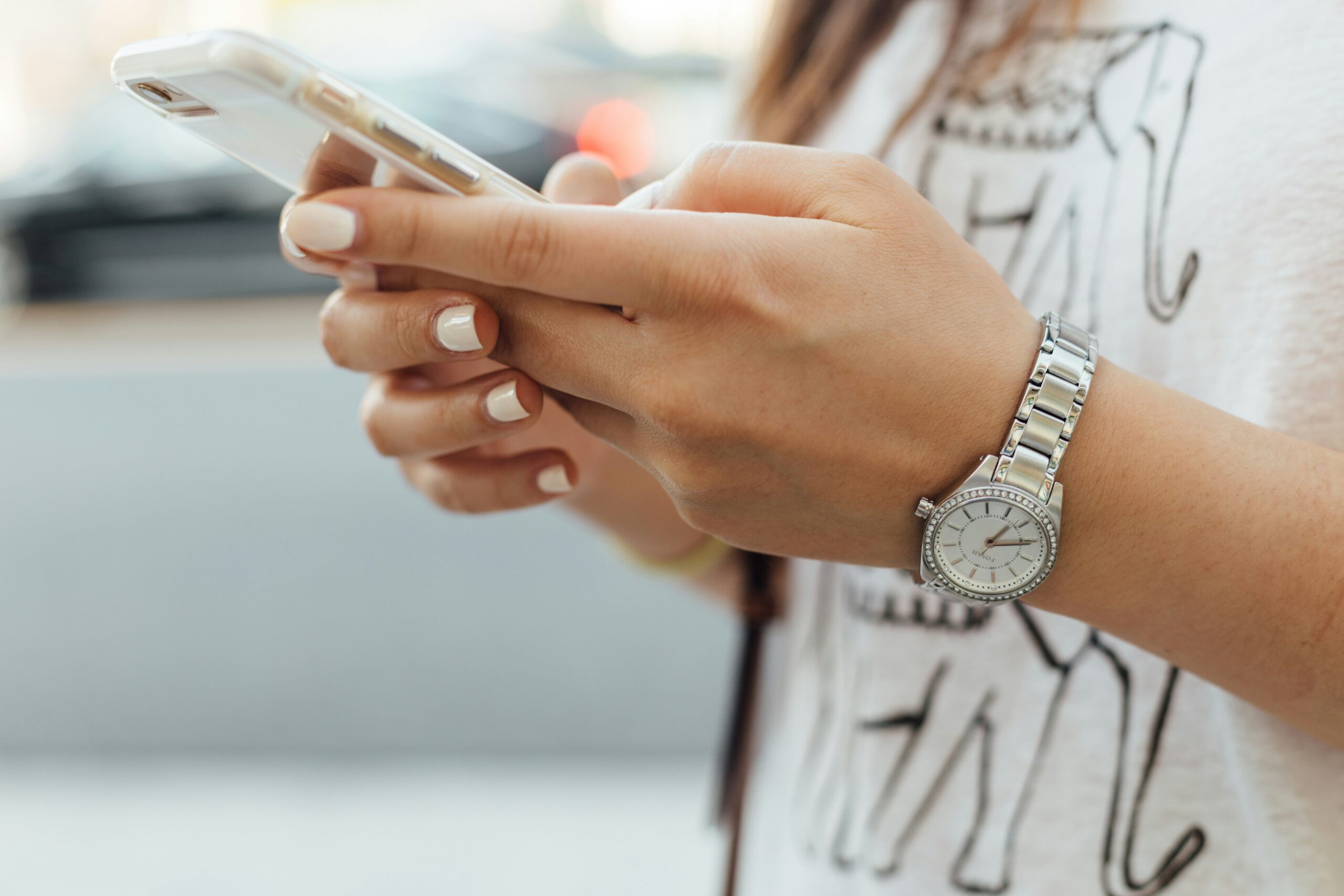 a woman using her phone - AI Marketing Tools a woman using her phone