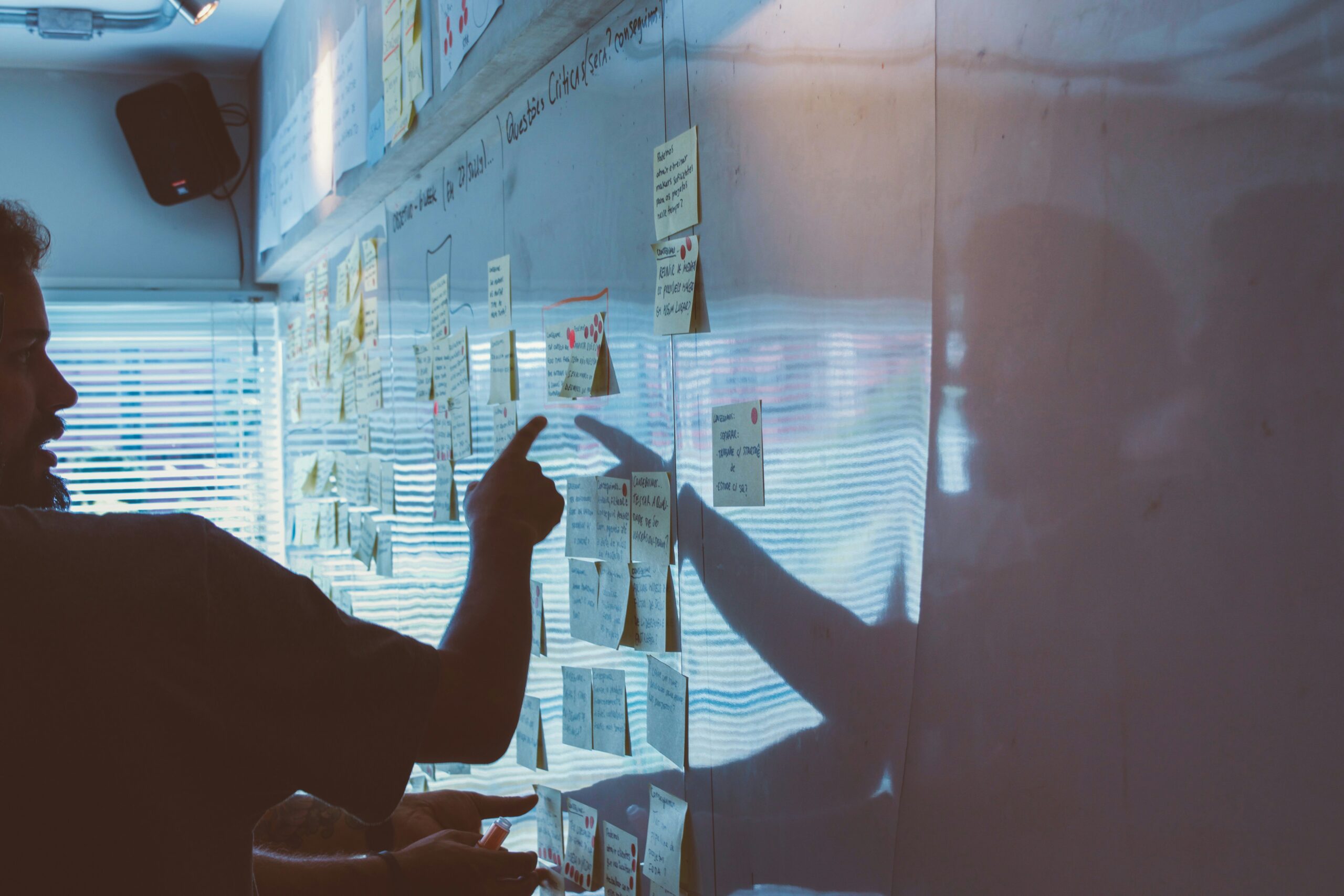 planning a strategy on a white board using sticky notes - AI Marketing Tools planning a strategy on a white board using sticky notes