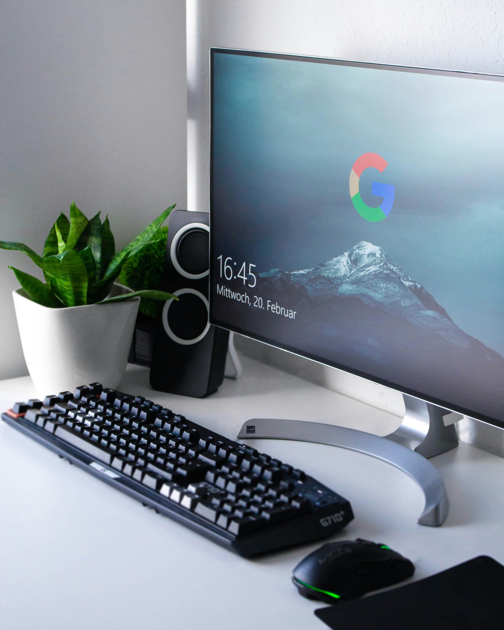 Desktop setup with Google login screen, keyboard, and indoor plant, symbolizing digital workspace readiness. - AI Marketing Tools Desktop setup with Google login screen, keyboard, and indoor plant, symbolizing digital workspace readiness.