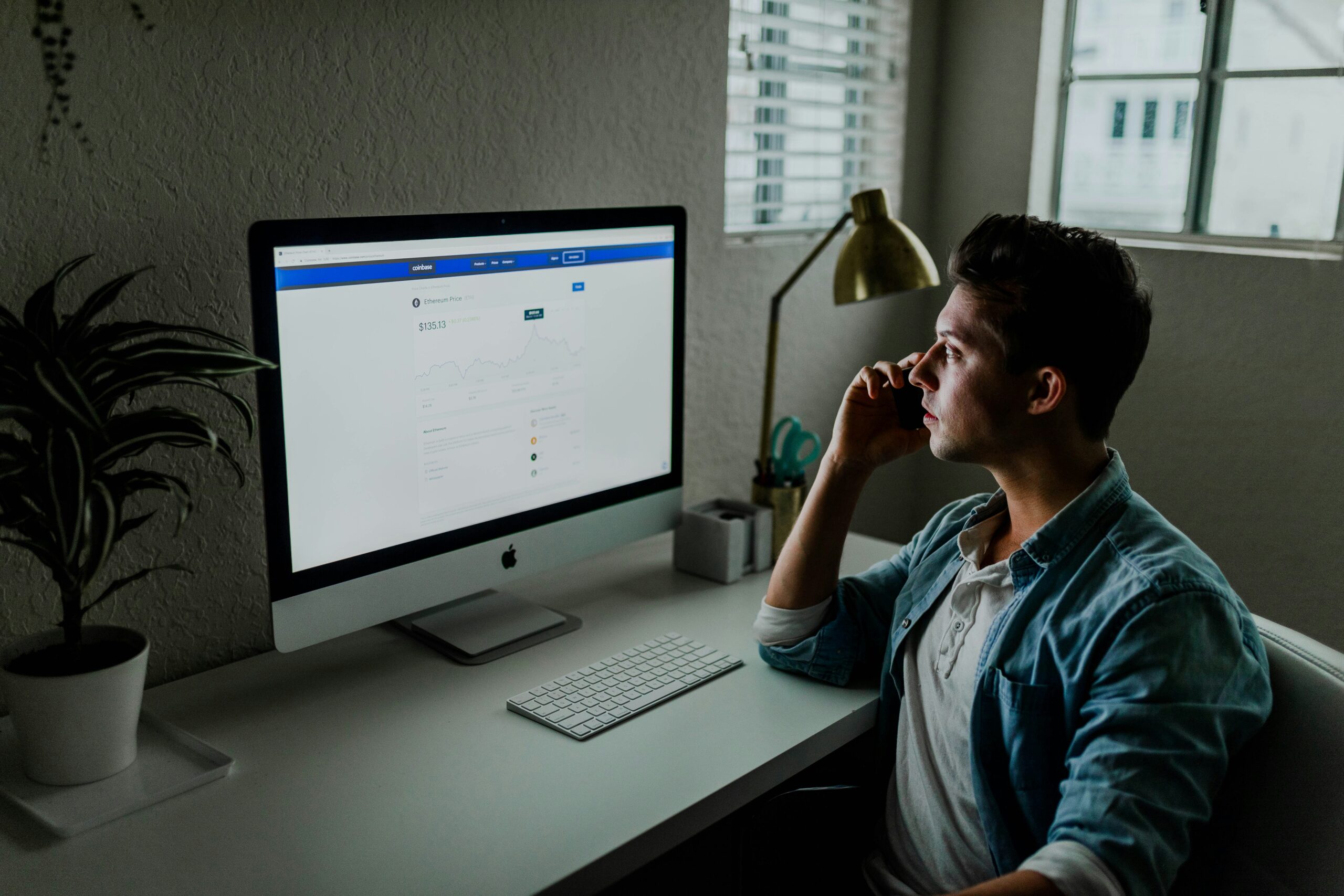 man on call looking at the desktop