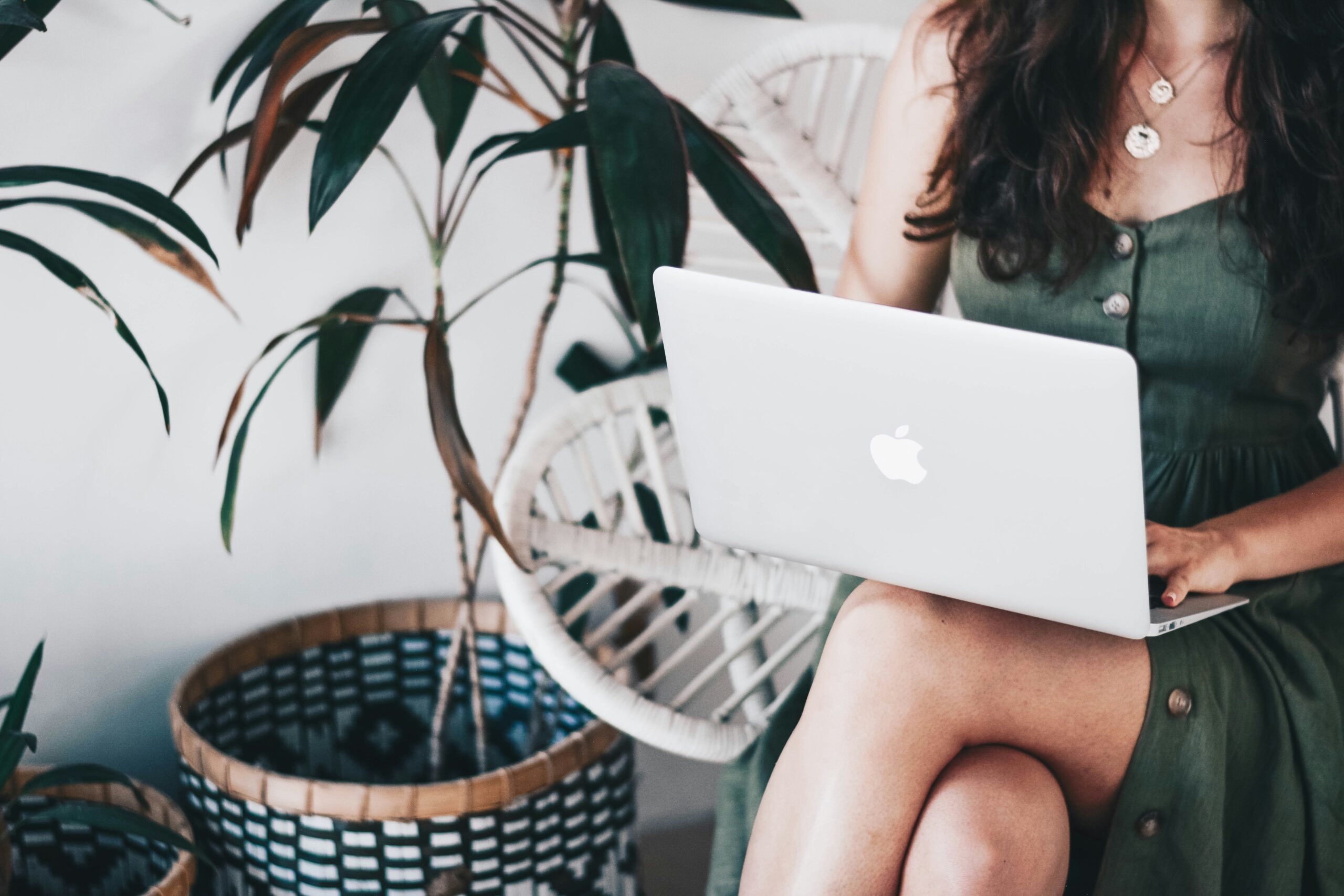 a woman working on her laptop - AI Marketing Tools a woman working on her laptop
