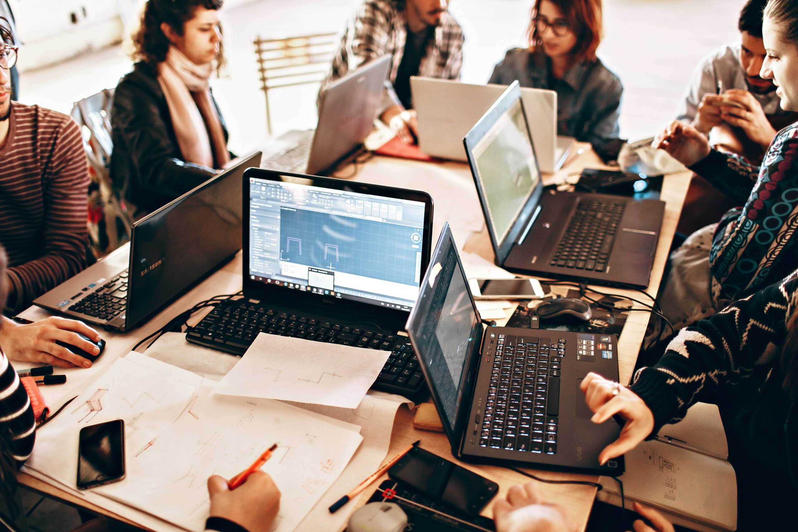 office work space with a team working - AI Marketing Tools office work space with a team working