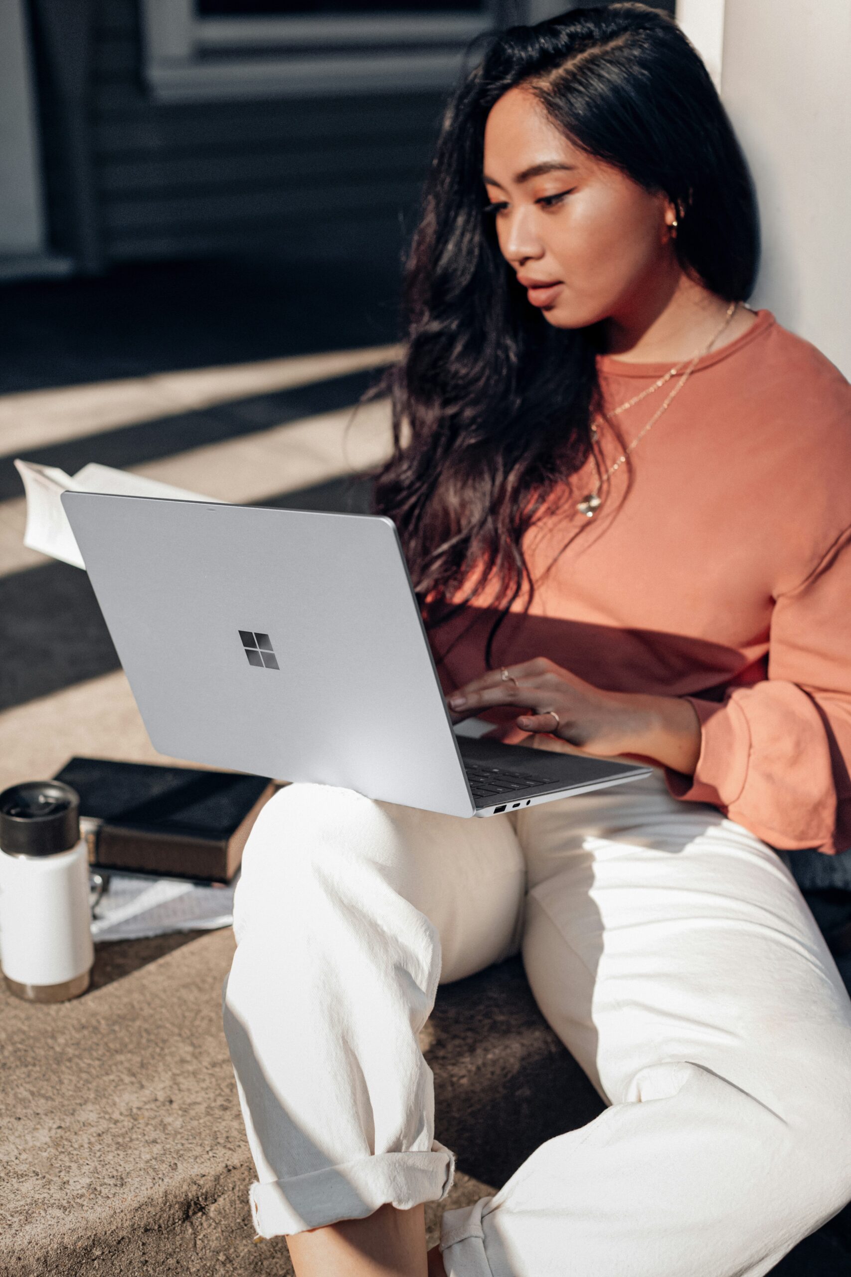 a woman using her laptop - AI Marketing Tools a woman using her laptop