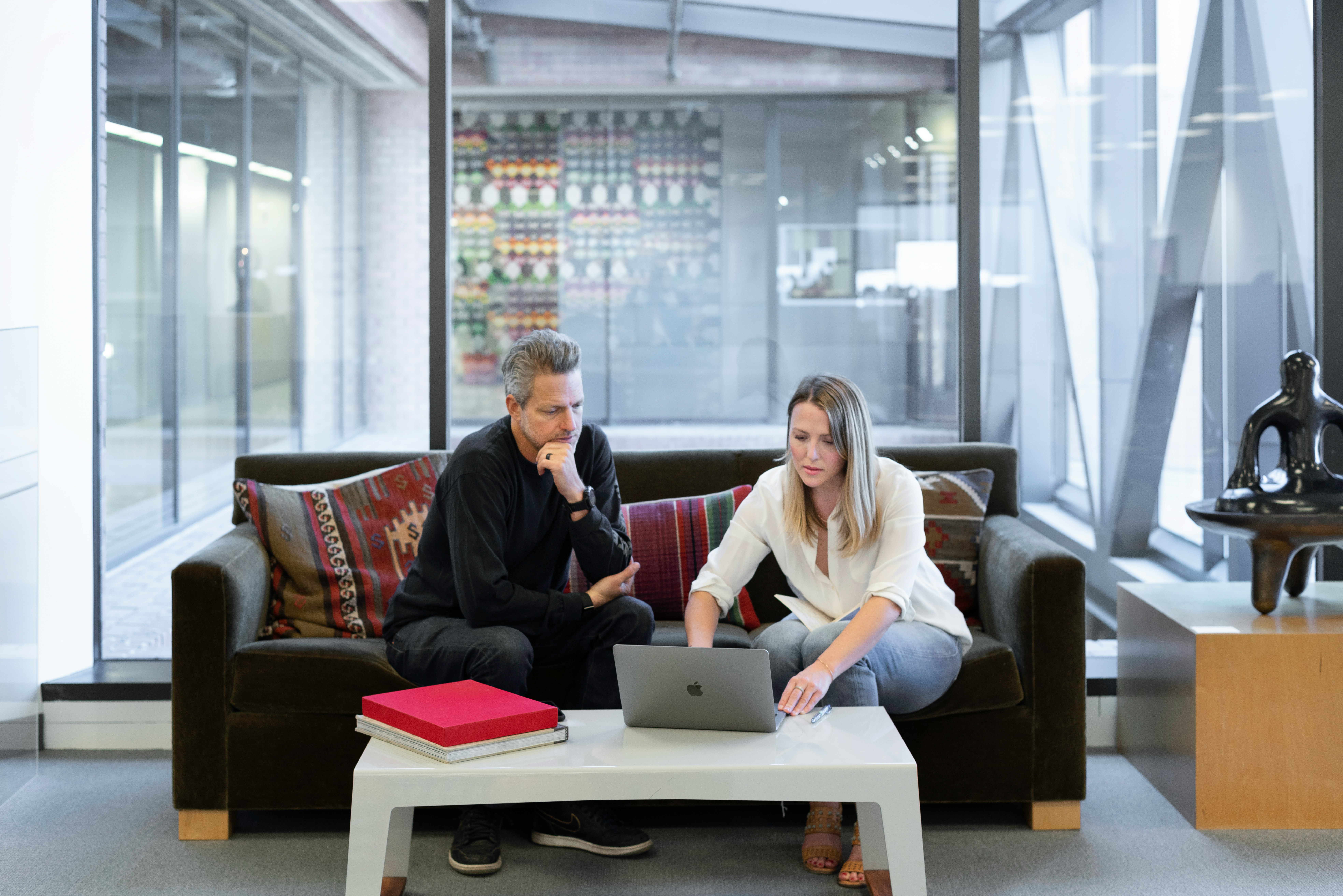 two professionals having a strategy meeting - AI Marketing Tools two professionals having a strategy meeting