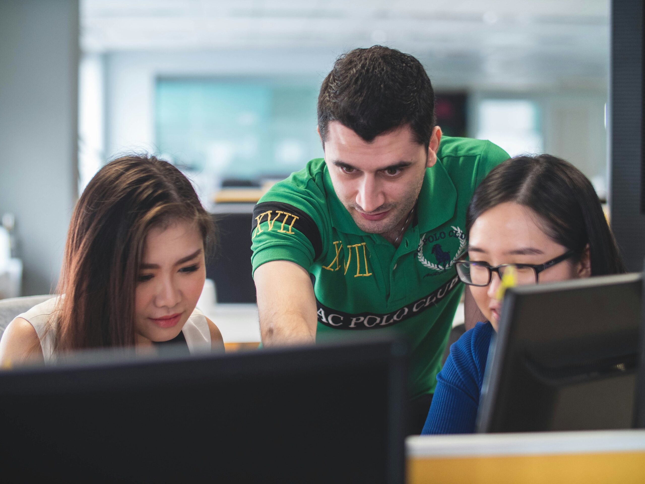 Colleagues analyzing AI-generated content results on a screen - AI Marketing Tools Colleagues analyzing AI-generated content results on a screen
